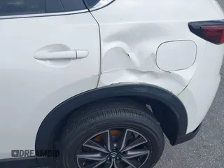 2018 Mazda CX-5 Touring z VIN JM3KFACM6J1419663, wystawiony jako IAAI lot #41879677 z przebiegiem 115 224 mil mil oraz . Historia ofert i sprzedaży dostępna na DreamBid. Obrazek 21.