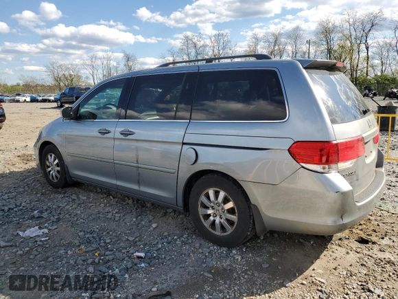 2010 Honda Odyssey EX-L with VIN 5FNRL3H78AB030903, listed as a Copart auction lot 52911705 with 200,499 mi miles and Salvage Title. Bid and sale history available at carsss.com. Image 2.