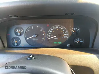 1999 Jeep Grand Cherokee Limited with VIN 1J4GW68N8XC770305, listed as a IAAI auction lot 41720558 with 206,180 mi miles. Bid and sale history available at carsss.com. Image 7.