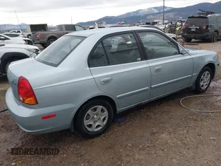 2003 Hyundai Accent GL with VIN KMHCG45C43U465523, listed as a IAAI auction lot 40883056 with 95,770 mi miles. Bid and sale history available at carsss.com. Image 4.