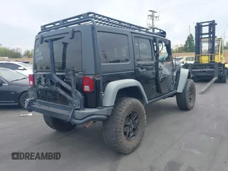 2014 Jeep Wrangler Unlimited Rubicon with VIN 1C4BJWFGXEL172622, listed as a IAAI auction lot 41782796 with 67,594 mi miles. Bid and sale history available at carsss.com. Image 4.