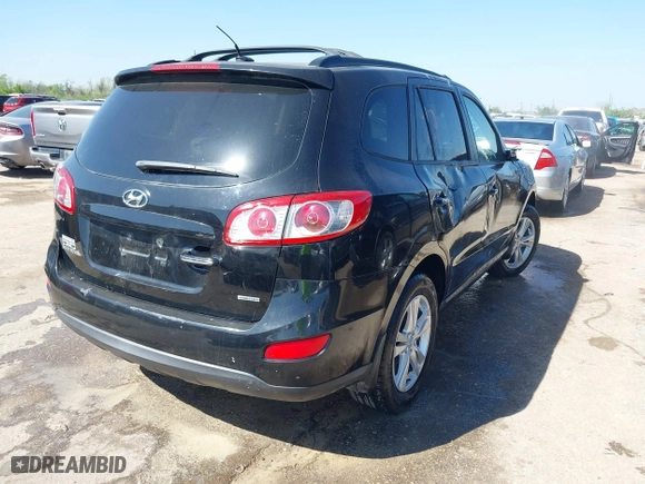 2012 Hyundai Santa Fe Limited with VIN 5XYZK3AB1CG120312, listed as a IAAI auction lot 41855080 with 143,783 mi miles. Bid and sale history available at carsss.com. Image 4.