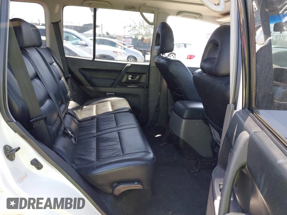 2003 Mitsubishi Montero Limited z VIN JA4NW51S43J017989, wystawiony jako IAAI lot #41963880 z przebiegiem 161 443 mil mil oraz . Historia ofert i sprzedaży dostępna na DreamBid. Obrazek 8.