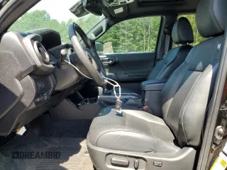 2023 Toyota Tacoma SR with VIN 3TMCZ5AN3PM571922, listed as a Copart auction lot 61872775 with 34,501 mi miles and Salvage title. Bid and sale history available at DreamBid. Image 7.