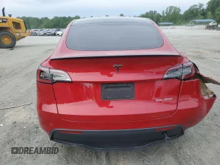 2023 Tesla Model Y Performance z VIN 7SAYGDEF2PF857843, wystawiony jako Copart lot #57324255 z przebiegiem 22 618 mil mil oraz Szkoda całkowita • Salvage title. Historia ofert i sprzedaży dostępna na DreamBid. Obrazek 6.