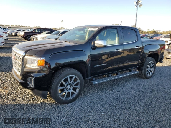 2021 GMC Canyon 2WD Denali with VIN 1GTG5EEN2M1107052, listed as a Copart auction lot 76377704 with 11,696 mi miles and Salvage Title. Bid and sale history available at carsss.com. Image 1.