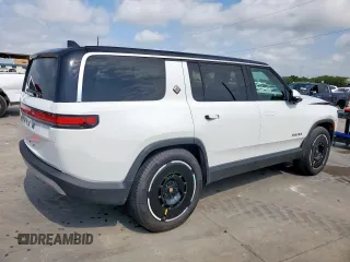 2025 Rivian R1S Adventure z VIN 7PDSGBBA3SN046975, wystawiony jako Copart lot #61790405 z przebiegiem 8 427 mil mil oraz Szkoda całkowita • Salvage title. Historia ofert i sprzedaży dostępna na DreamBid. Obrazek 3.