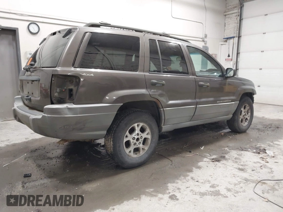 1999 Jeep Grand Cherokee Laredo with VIN 1J4GW58SXXC584734, listed as a IAAI auction lot 41902224 with 209,180 mi miles and . Bid and sale history available at DreamBid. Image 4.