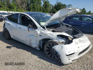 2024 Tesla Model Y Performance with VIN 7SAYGDEF4RF064210, listed as a Copart auction lot 52498805 with 14,318 mi miles and Non Repairable. Bid and sale history available at DreamBid. Image 4.