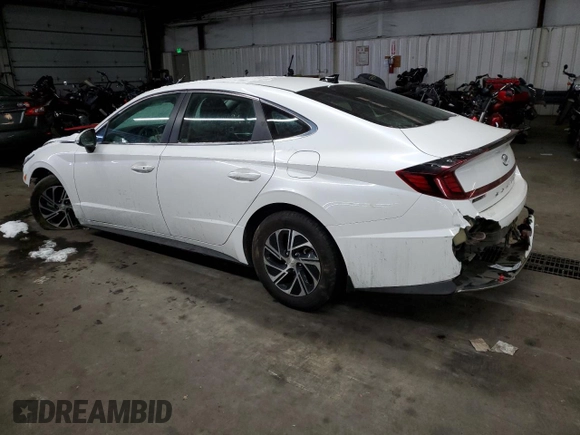2021 Hyundai Sonata Hybrid Blue with VIN KMHL24JJ4MA021239, listed as a Copart auction lot 87680405 with 106,964 mi miles and Salvage Title. Bid and sale history available at carsss.com. Image 2.