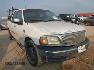 2002 Ford F-150 XLT with VIN 1FTRW07602KB74836, listed as a IAAI auction lot 42069307 with 295,692 mi miles. Bid and sale history available at carsss.com. Image 1.