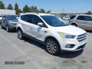 2018 Ford Escape Titanium with VIN 1FMCU0J94JUB26110, listed as a IAAI auction lot 42436285 with 59,586 mi miles and . Bid and sale history available at DreamBid. Image 1.