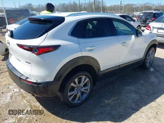 2022 Mazda CX-30 S Premium with VIN 3MVDMBDL1NM413540, listed as a IAAI auction lot 41681191 with 57,764 mi miles and . Bid and sale history available at carsss.com. Image 4.