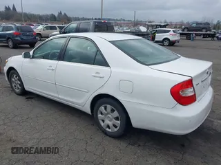 2002 Toyota Camry LE z VIN 4T1BE32K52U081479, wystawiony jako IAAI lot #41344104 z przebiegiem 243 950 mil mil oraz . Historia ofert i sprzedaży dostępna na DreamBid. Obrazek 3.
