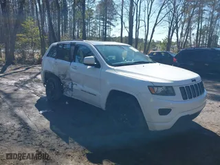 2015 Jeep Grand Cherokee Altitude with VIN 1C4RJFAG4FC924869, listed as a IAAI auction lot 41656444 with 112,786 mi miles. Bid and sale history available at carsss.com. Image 1.