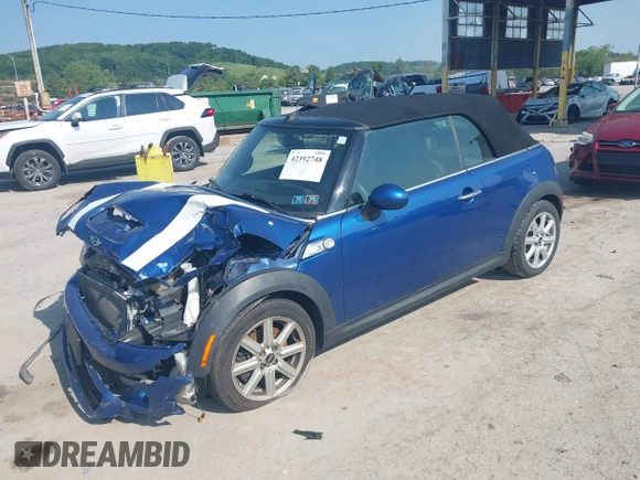2013 MINI Convertible S with VIN WMWZP3C5XDT705613, listed as a IAAI auction lot 42392748 with 87,477 mi miles and . Bid and sale history available at DreamBid. Image 2.
