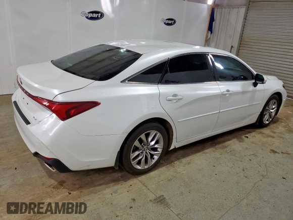 2021 Toyota Avalon XLE z VIN 4T1AZ1FB0MU060010, wystawiony jako Copart lot #56844085 z przebiegiem 115 788 mil mil oraz Czysty tytuł • Clean title. Historia ofert i sprzedaży dostępna na DreamBid. Obrazek 3.