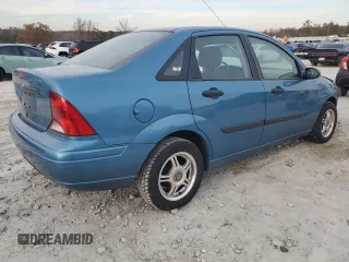 2001 Ford Focus LX with VIN 1FAHP33P01W332260, listed as a Copart auction lot 83221654 with 104,028 mi miles and Salvage Title. Bid and sale history available at DreamBid. Image 3.