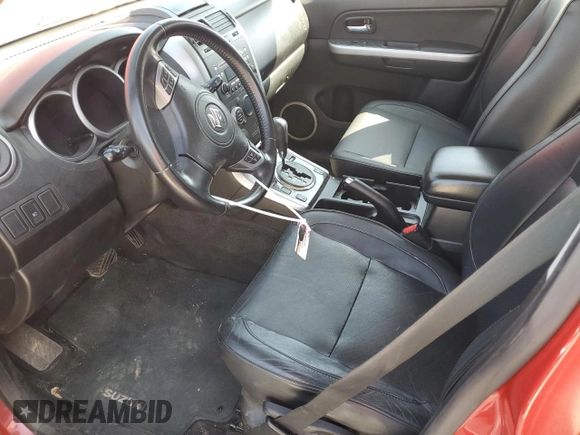 2011 Suzuki Grand Vitara Limited z VIN JS3TE0D72B4100054, wystawiony jako Copart lot #52535705 z przebiegiem 131 468 mil mil oraz Szkoda całkowita • Salvage title. Historia ofert i sprzedaży dostępna na DreamBid. Obrazek 7.