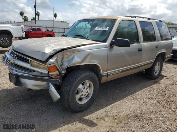 1999 Chevrolet Tahoe Z71 with VIN 1GNEK13R0XJ444734, listed as a Copart auction lot 76323384 with 160,631 mi miles and Salvage Title. Bid and sale history available at carsss.com. Image 1.