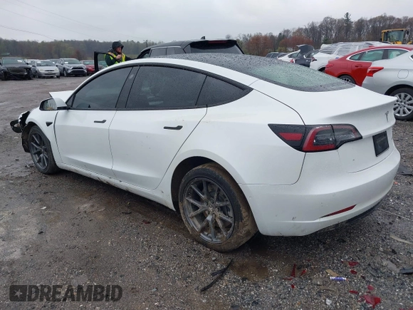 2022 Tesla Model 3 Long Range with VIN 5YJ3E1EB0NF129945, listed as a IAAI auction lot 41965531 with 59,162 mi miles and . Bid and sale history available at DreamBid. Image 3.
