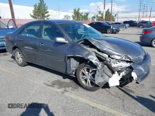 2005 Toyota Camry LE with VIN 4T1BF32K25U603812, listed as a IAAI auction lot 41740671 with 242,316 mi miles and . Bid and sale history available at DreamBid. Image 1.