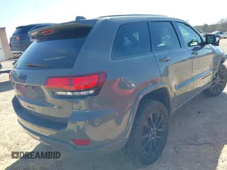 2019 Jeep Grand Cherokee Laredo E with VIN 1C4RJFAG2KC855108, listed as a IAAI auction lot 41780277 with 81,283 mi miles and . Bid and sale history available at DreamBid. Image 4.