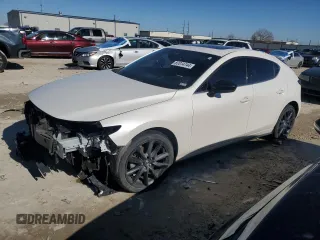 2021 Mazda Mazda3 Hatchback 2.5 Turbo with VIN JM1BPBJY2M1339587, listed as a Copart auction lot 87014744 with 49,711 mi miles and Salvage Title. Bid and sale history available at carsss.com. Image 1.