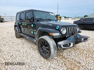 2022 Jeep Wrangler Unlimited Sahara with VIN 1C4JJXP61NW170425, listed as a Copart auction lot 60683715 with 51,847 mi miles and Salvage title. Bid and sale history available at DreamBid. Image 4.