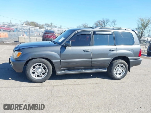 2003 Lexus LX with VIN JTJHT00W033531066, listed as a IAAI auction lot 41969617 with 209,710 mi miles. Bid and sale history available at carsss.com. Image 14.
