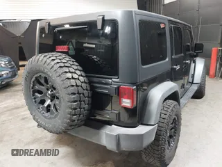 2015 Jeep Wrangler Unlimited Willys Wheeler with VIN 1C4BJWDG1FL749803, listed as a IAAI auction lot 41995132 with 156,595 mi miles and . Bid and sale history available at DreamBid. Image 4.