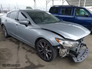 2017 Mazda Mazda6 Touring with VIN JM1GL1V59H1122054, listed as a IAAI auction lot 41896616 with 114,422 mi miles. Bid and sale history available at carsss.com. Image 1.