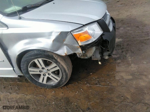 2010 Dodge Grand Caravan SXT with VIN 2D4RN5DX1AR127914, listed as a IAAI auction lot 41720511 with 169,953 mi miles. Bid and sale history available at carsss.com. Image 6.