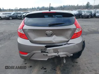 2013 Hyundai Accent SE z VIN KMHCU5AE1DU079830, wystawiony jako IAAI lot #41529695 z przebiegiem 105 637 mil mil oraz . Historia ofert i sprzedaży dostępna na DreamBid. Obrazek 16.