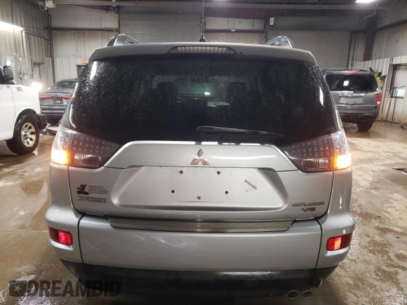 2010 Mitsubishi Outlander XLS z VIN JA4JT4AX9AZ002688, wystawiony jako Copart lot #51173605 z przebiegiem 162 147 mil mil oraz Szkoda całkowita • Salvage title. Historia ofert i sprzedaży dostępna na DreamBid. Obrazek 6.