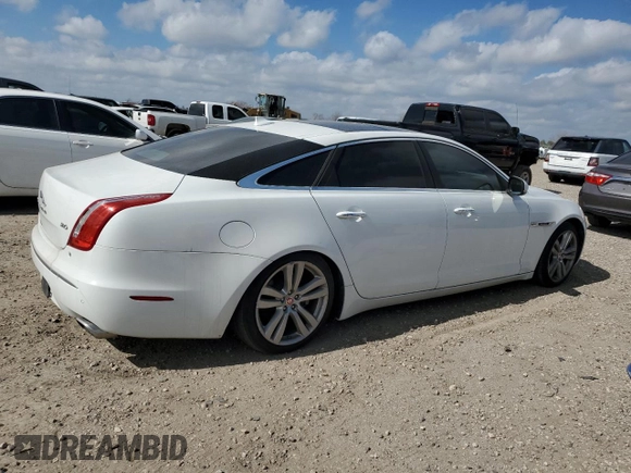 2014 Jaguar XJ with VIN SAJWA2GZ3E8V70365, listed as a Copart auction lot 42545995 with 65,649 mi miles and Salvage Title. Bid and sale history available at carsss.com. Image 3.