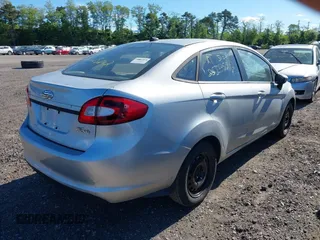 2013 Ford Fiesta S with VIN 3FADP4AJ6DM223132, listed as a IAAI auction lot 42317500 with 104,003 mi miles and . Bid and sale history available at DreamBid. Image 4.