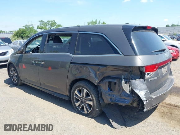 2014 Honda Odyssey Touring with VIN 5FNRL5H90EB082691, listed as a IAAI auction lot 42572977 with 54,413 mi miles and . Bid and sale history available at DreamBid. Image 3.