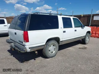 1996 Chevrolet Suburban with VIN 1GNFK16R9TJ411712, listed as a IAAI auction lot 42070739 with 242,044 mi miles. Bid and sale history available at carsss.com. Image 4.
