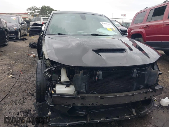 2018 Dodge Charger SXT Plus with VIN 2C3CDXHG0JH289216, listed as a IAAI auction lot 42085449 with 90,902 mi miles and . Bid and sale history available at DreamBid. Image 6.