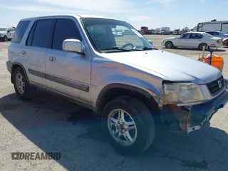 1999 Honda CR-V EX with VIN JHLRD1861XC025446, listed as a IAAI auction lot 41852155 with 201,598 mi miles. Bid and sale history available at carsss.com. Image 1.