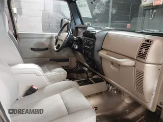 2004 Jeep Wrangler Sahara with VIN 1J4FA59S64P736389, listed as a IAAI auction lot 41432819 with 102,830 mi miles and . Bid and sale history available at DreamBid. Image 5.