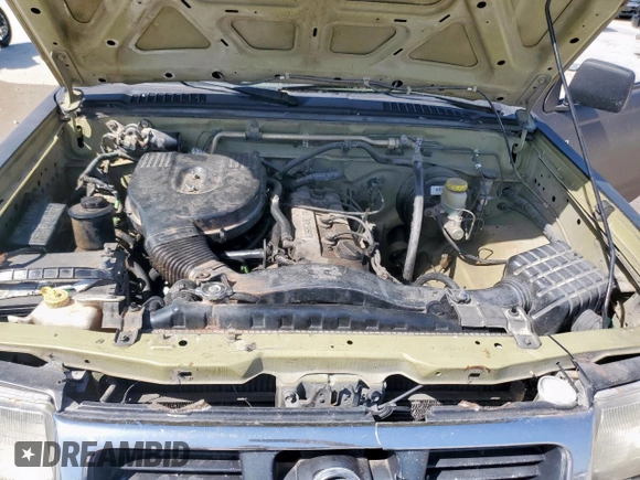 2001 Nissan Frontier XE z VIN 1N6DD21SX1C386232, wystawiony jako Copart lot #52915155 z przebiegiem 174 268 mil mil oraz Czysty tytuł • Clean title. Historia ofert i sprzedaży dostępna na DreamBid. Obrazek 11.