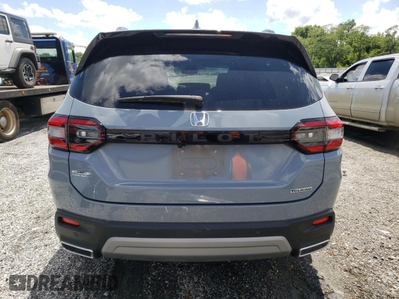 2023 Honda Pilot Touring with VIN 5FNYG2H78PB006054, listed as a Copart auction lot 56039785 with 35,831 mi miles and Salvage title. Bid and sale history available at DreamBid. Image 6.