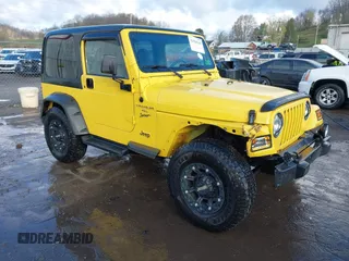 2001 Jeep Wrangler Sport z VIN 1J4FA49S21P370954, wystawiony jako IAAI lot #42028244 z przebiegiem 77 626 mil mil oraz . Historia ofert i sprzedaży dostępna na DreamBid. Obrazek 1.