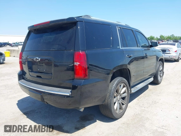2015 Chevrolet Tahoe LTZ with VIN 1GNSCCKC4FR309152, listed as a IAAI auction lot 42029341 with 187,313 mi miles and . Bid and sale history available at DreamBid. Image 4.