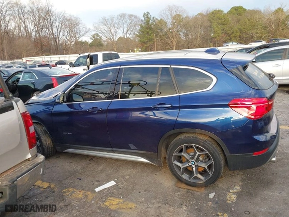 2016 BMW X1 xDrive28i with VIN WBXHT3C3XGP882221, listed as a IAAI auction lot 41581170 with 126,694 mi miles. Bid and sale history available at carsss.com. Image 14.