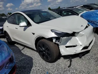 2025 Tesla Model Y Long Range with VIN 7SAYGDED4SF232433, listed as a Copart auction lot 51504015 with Not Provided miles and Salvage Title. Bid and sale history available at DreamBid. Image 4.