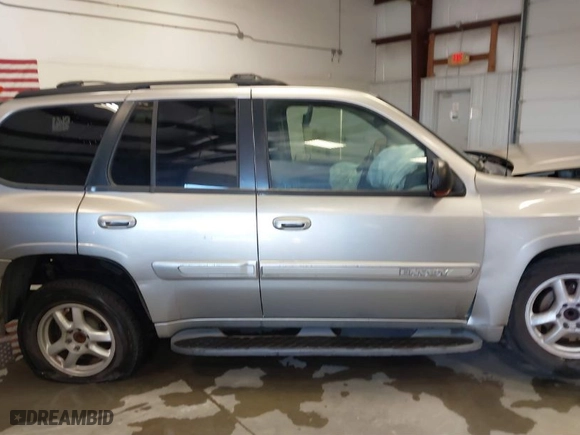 2003 GMC Envoy SLT with VIN 1GKDS13S932299354, listed as a IAAI auction lot 41238557 with 251,535 mi miles. Bid and sale history available at carsss.com. Image 14.