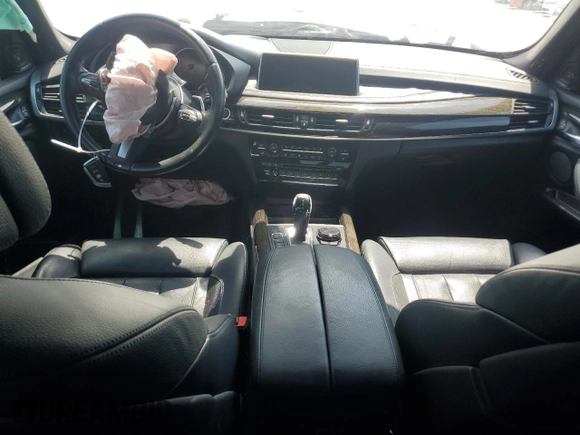 2015 BMW X5 xDrive50i z VIN 5UXKR6C50F0J75350, wystawiony jako Copart lot #55146105 z przebiegiem Nie podano mil oraz Szkoda całkowita • Salvage title. Historia ofert i sprzedaży dostępna na DreamBid. Obrazek 8.